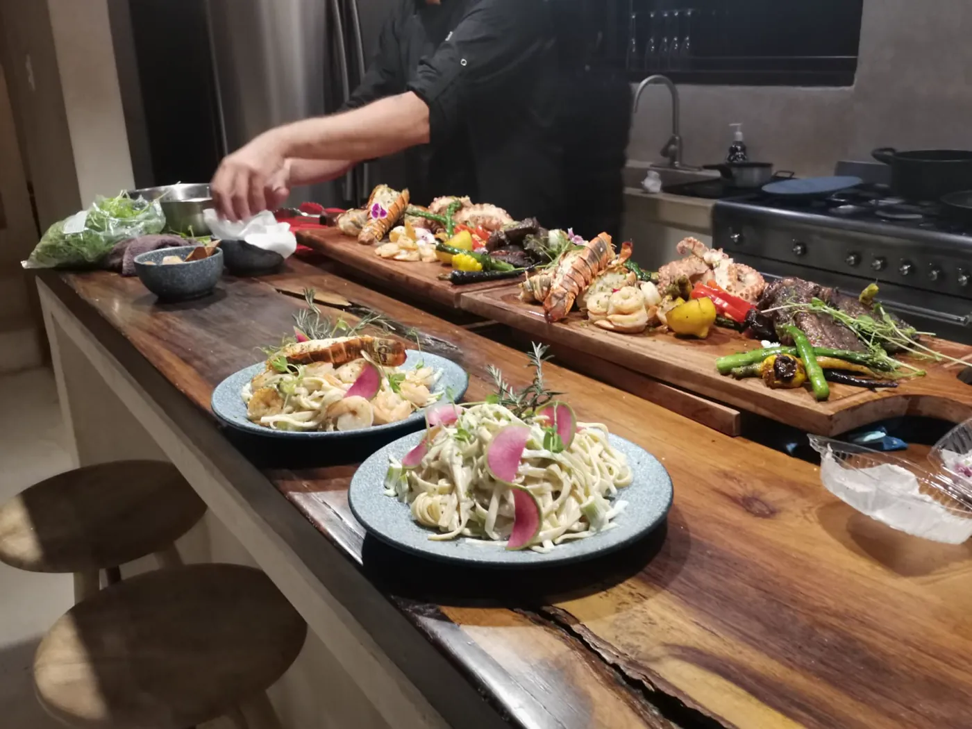 Plates lined along a villa kitchen counter